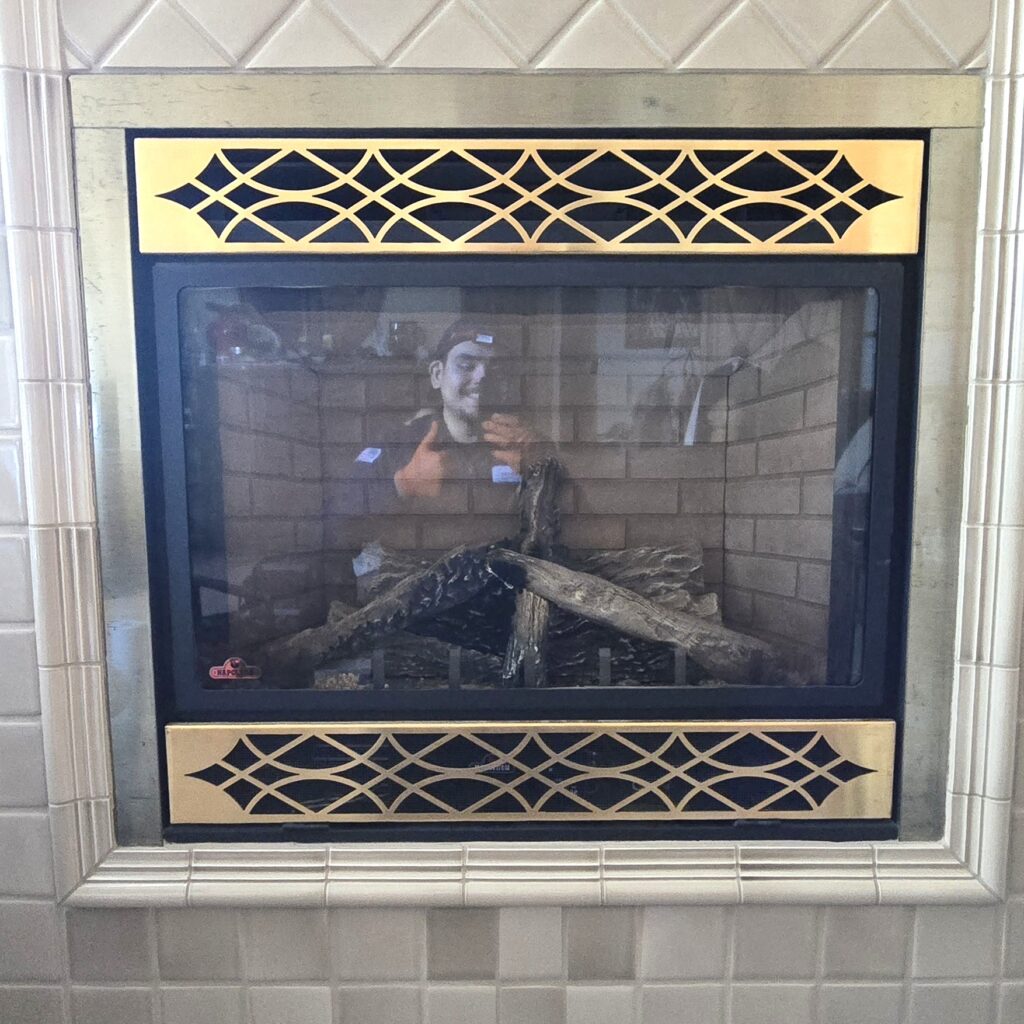 Gas fireplace insert with a decorative surround serviced by Sound Comfort Heating in Snohomish County