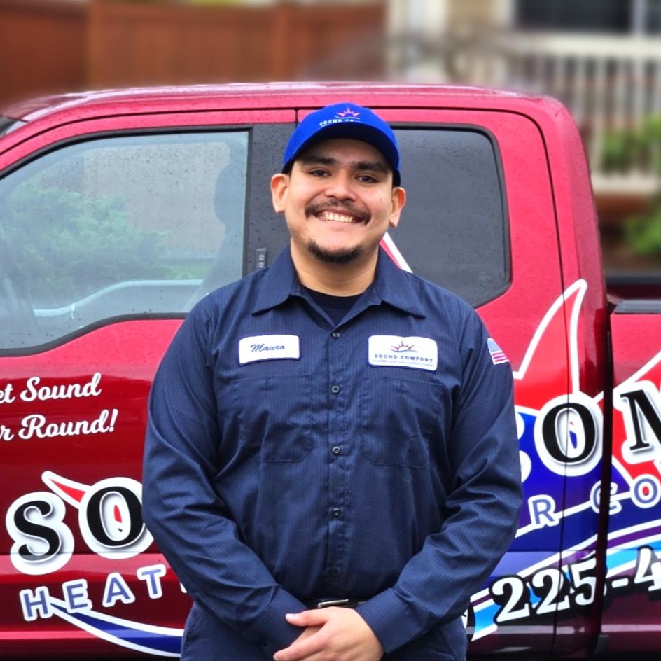 Sound Comfort Heating technician in front of service truck for furnace repair in Mill Creek